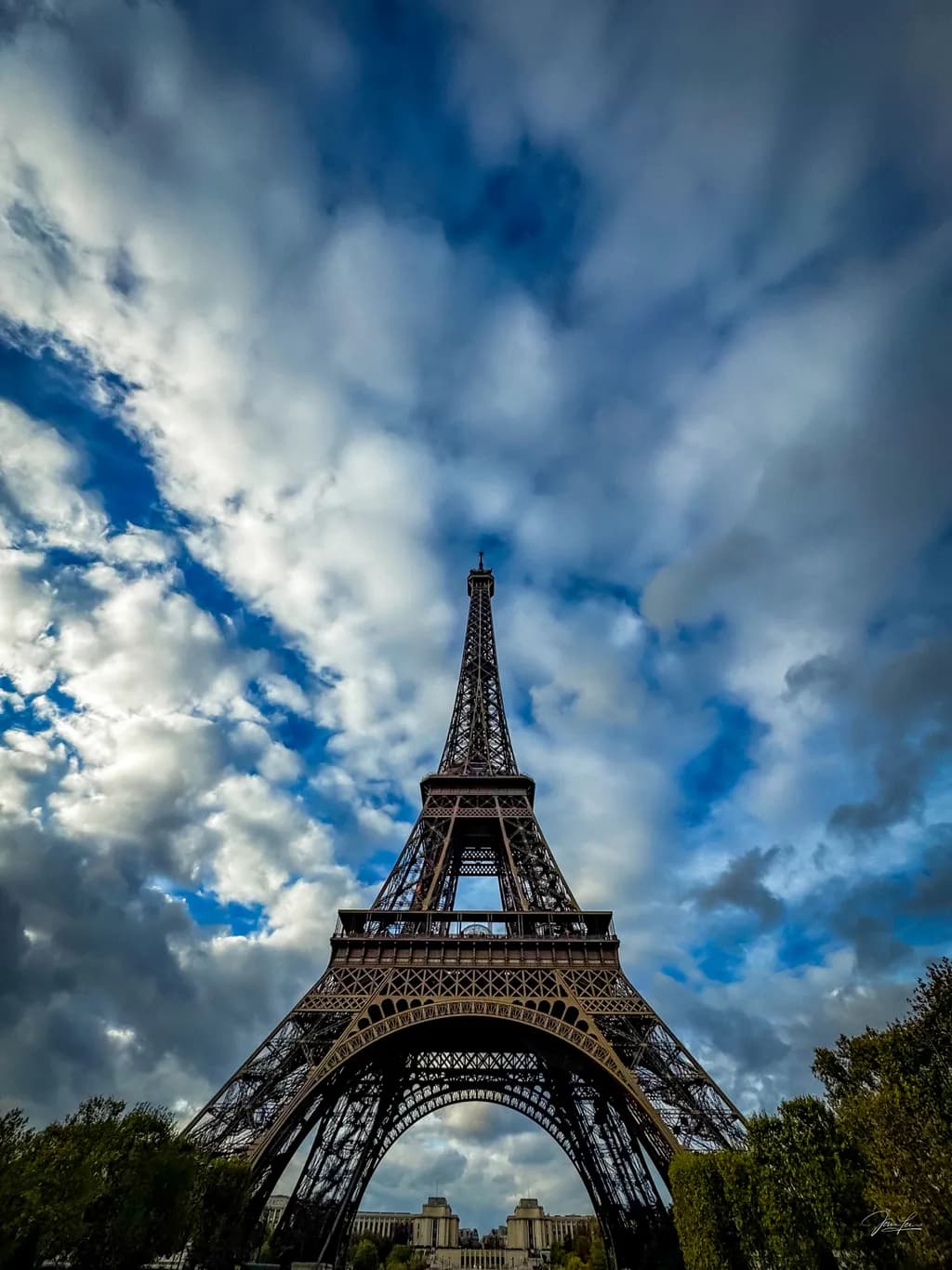 Eiffel Tower Majesty: A Dramatic Sky Over Paris