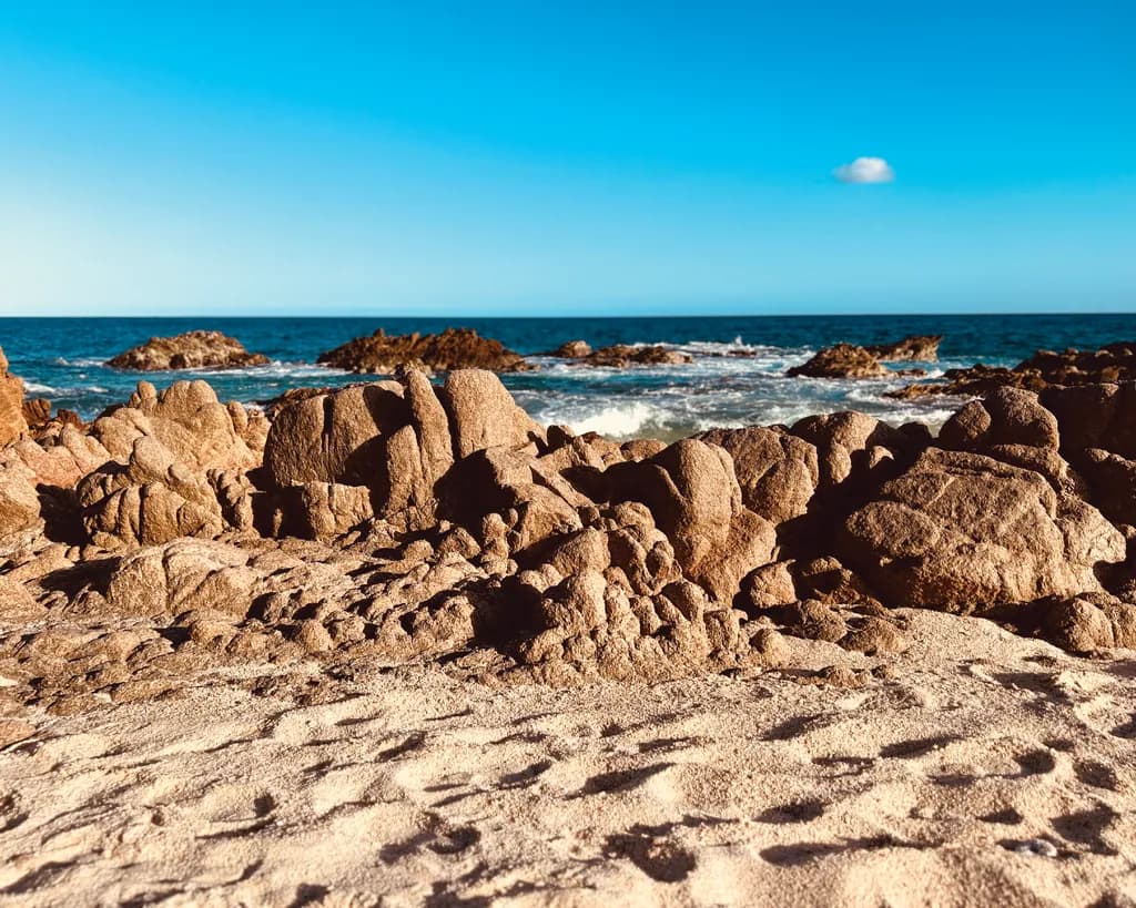 Serenity by the Shore: A Coastal Landscape of Rocks and Waves