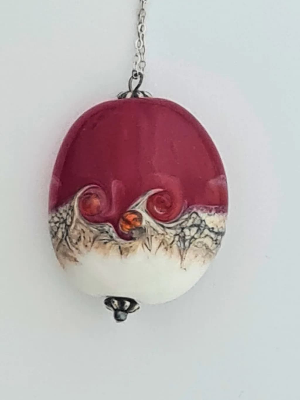 Whimsical Elegance: A Colorful Pendant with Artistic Swirls and Unique Detailing