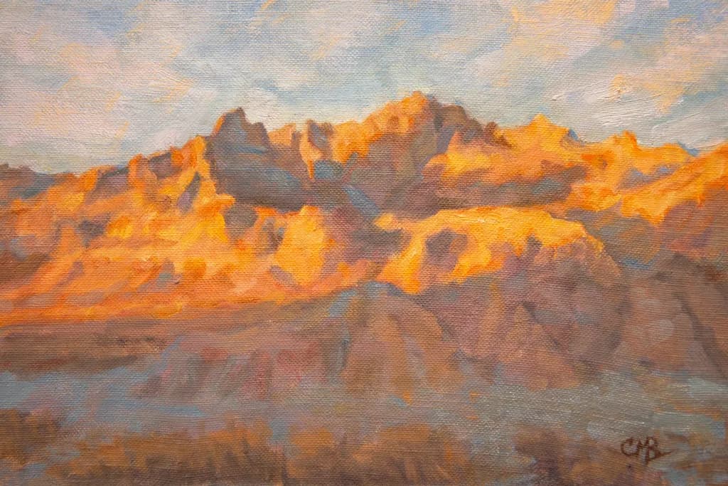 Golden Peaks at Dusk: A Serene Mountain Landscape in Warm Hues