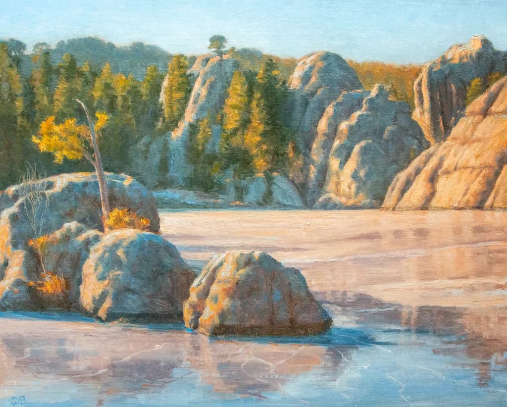 Serenity at Dawn: A Tranquil Landscape of Rocks and Reflections