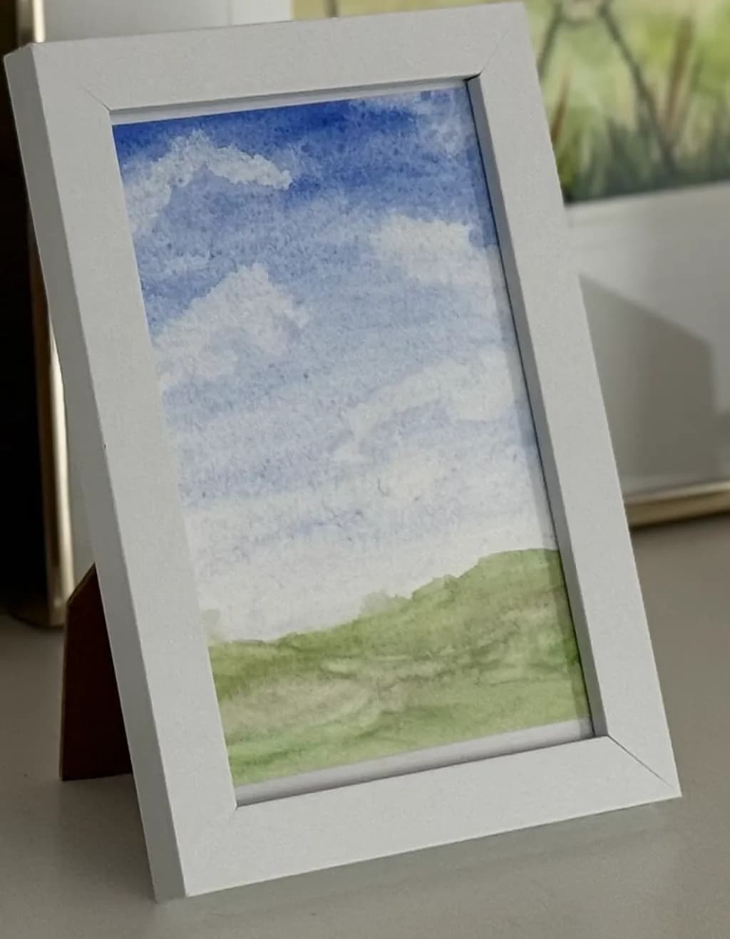 Whispers of the Sky: A Serene Watercolor Journey Through Clouds and Hills