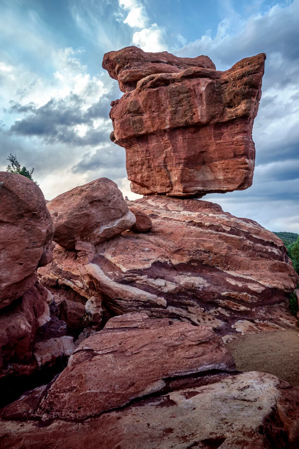 Balancing Nature's Artistry: The Majestic Rock Formation Against a Dramatic Sky