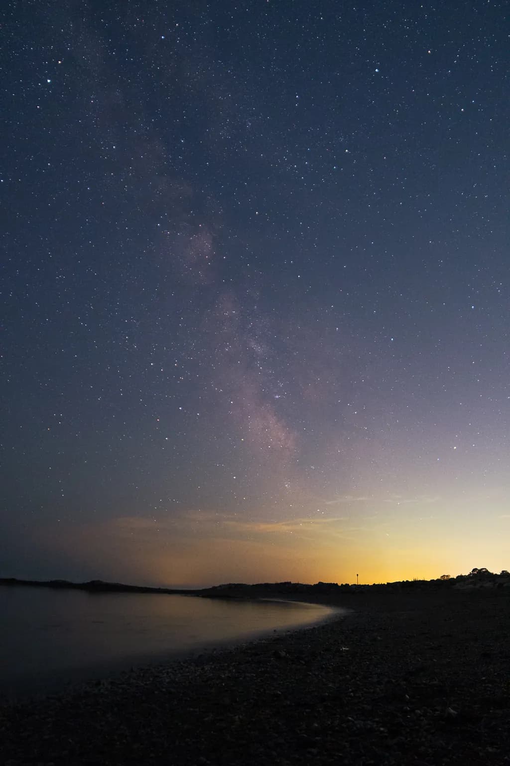 Celestial Serenity: A Tranquil Night by the Shore Under the Milky Way
