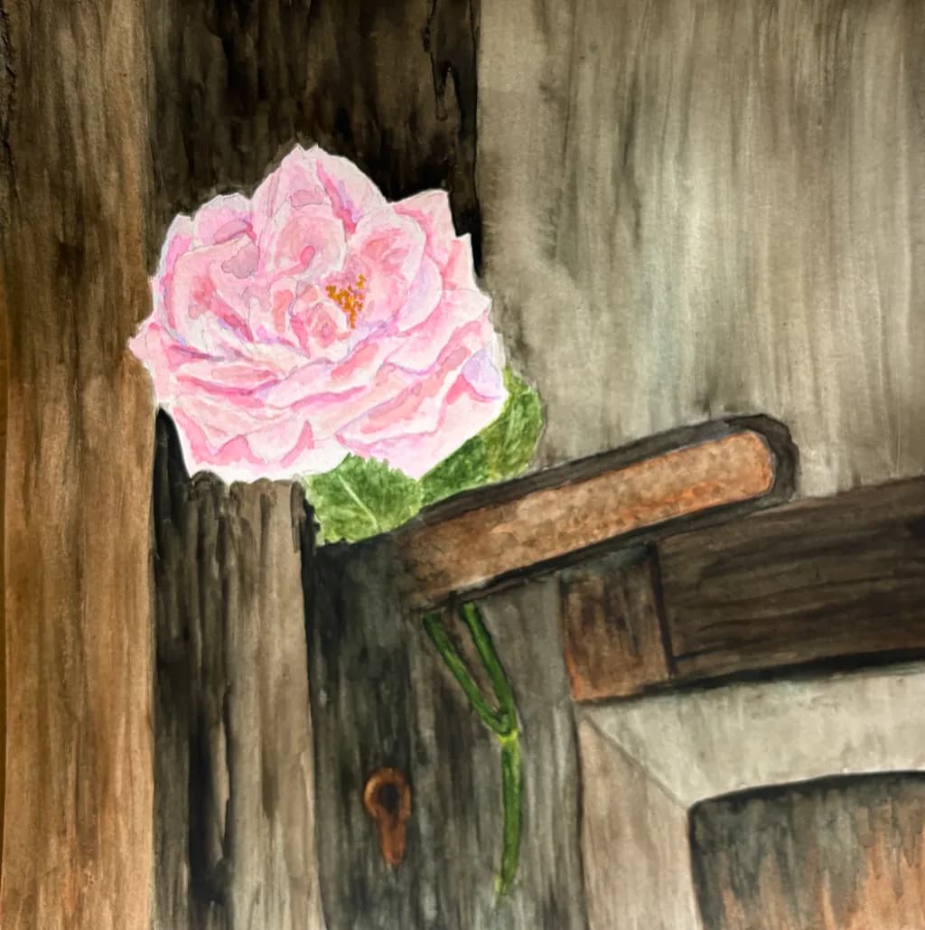 Whispers of Nature: A Delicate Pink Rose Embracing Weathered Wood