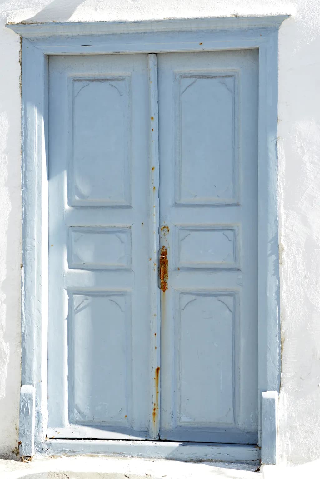 Whispers of Blue: A Rustic Doorway to Tranquility