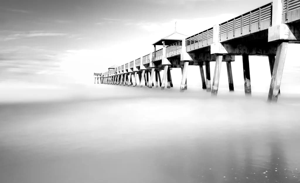 Ethereal Serenity: A Black and White Journey Along the Pier