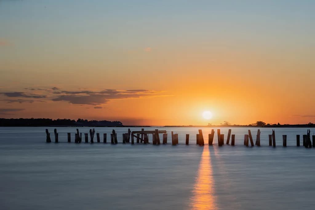 Serenity at Sunset: A Tranquil Reflection on Water's Edge