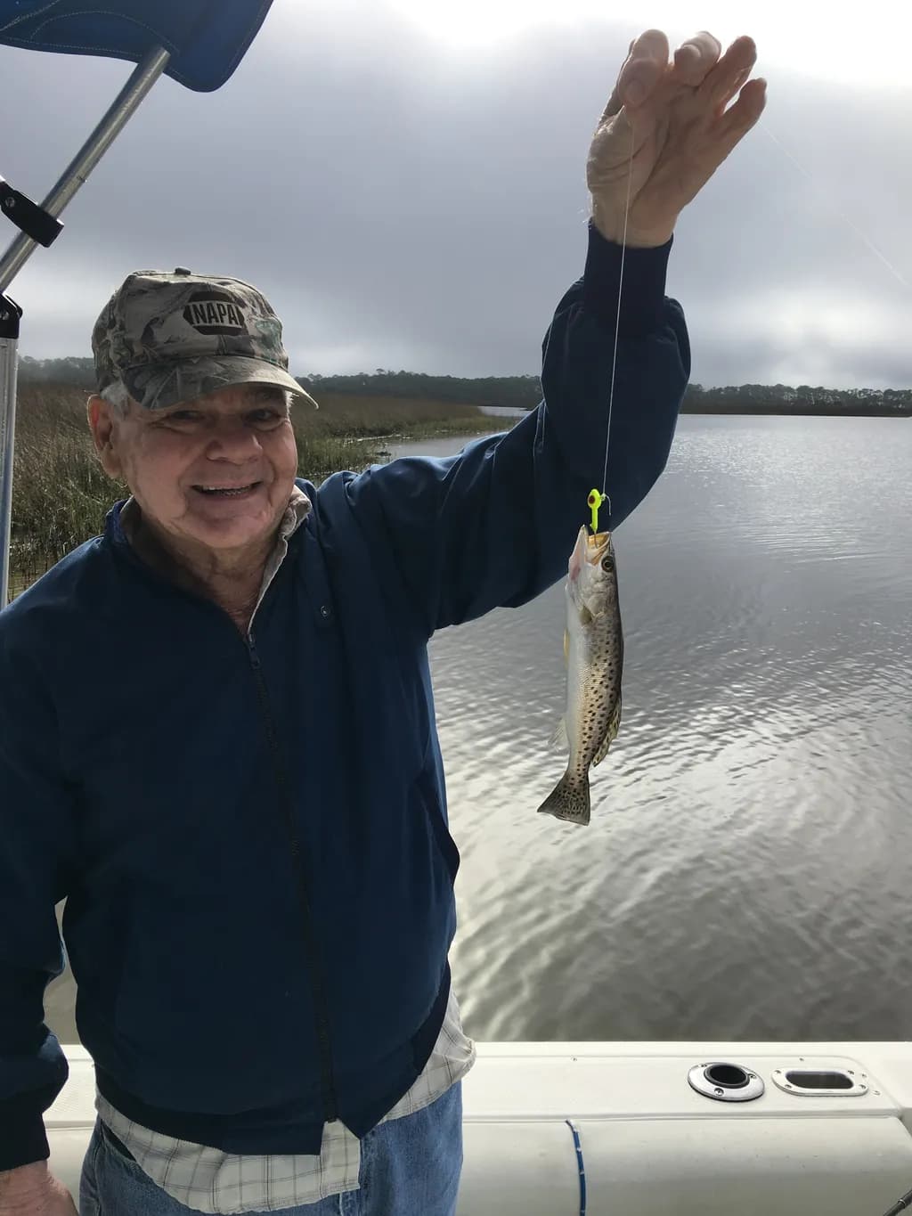 Fishing Memories: A Joyful Catch on a Serene Day by the Water