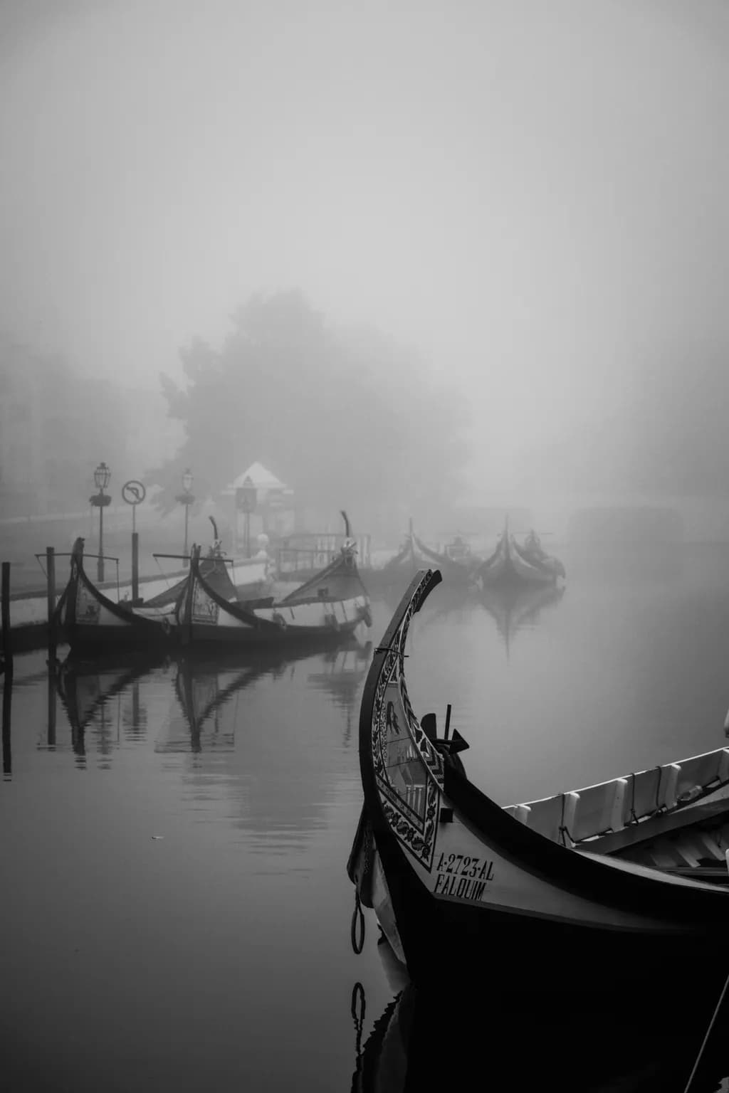 Whispers of the Fog: A Serene Gondola Reflection in Monochrome Waters