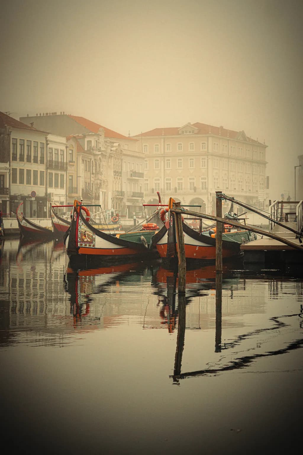 Whispers of the Fog: Gondolas at Dawn in a Serene Harbor