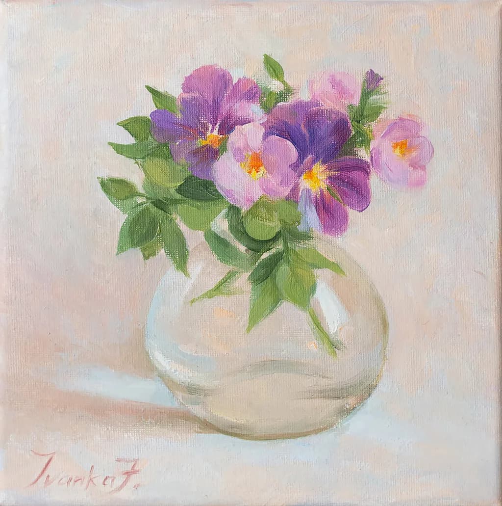Whispers of Spring: A Delicate Bouquet of Pansies in Glass Harmony