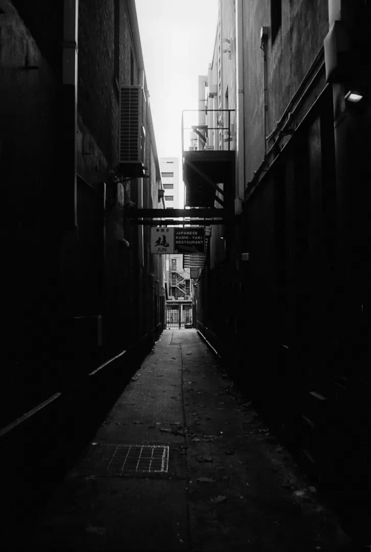 Whispers of Shadows: An Urban Alleyway in Monochrome Depth