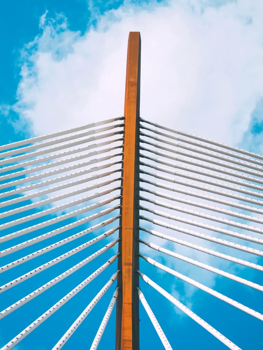 Skyward Symphony: A Dance of Structure and Clouds Over the Bridge of Dreams