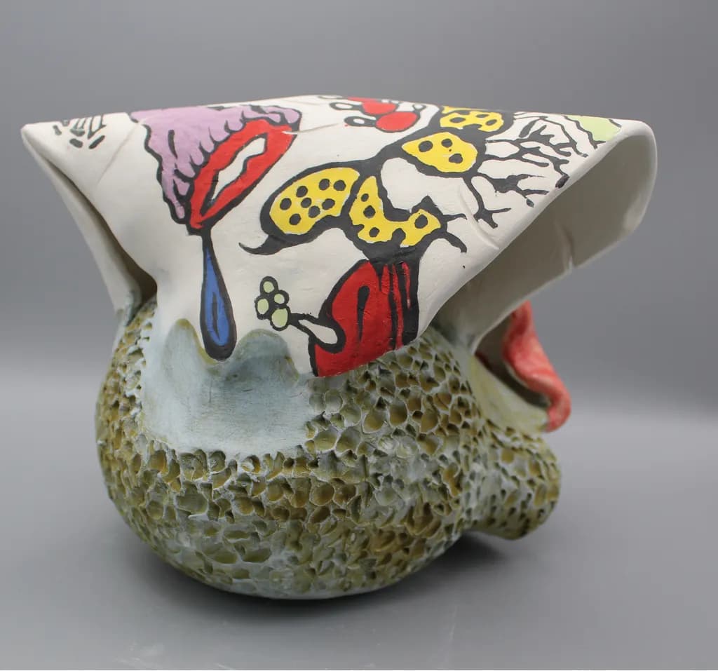 Whimsical Fusion: A Playful Ceramic Sculpture of Nature and Expression