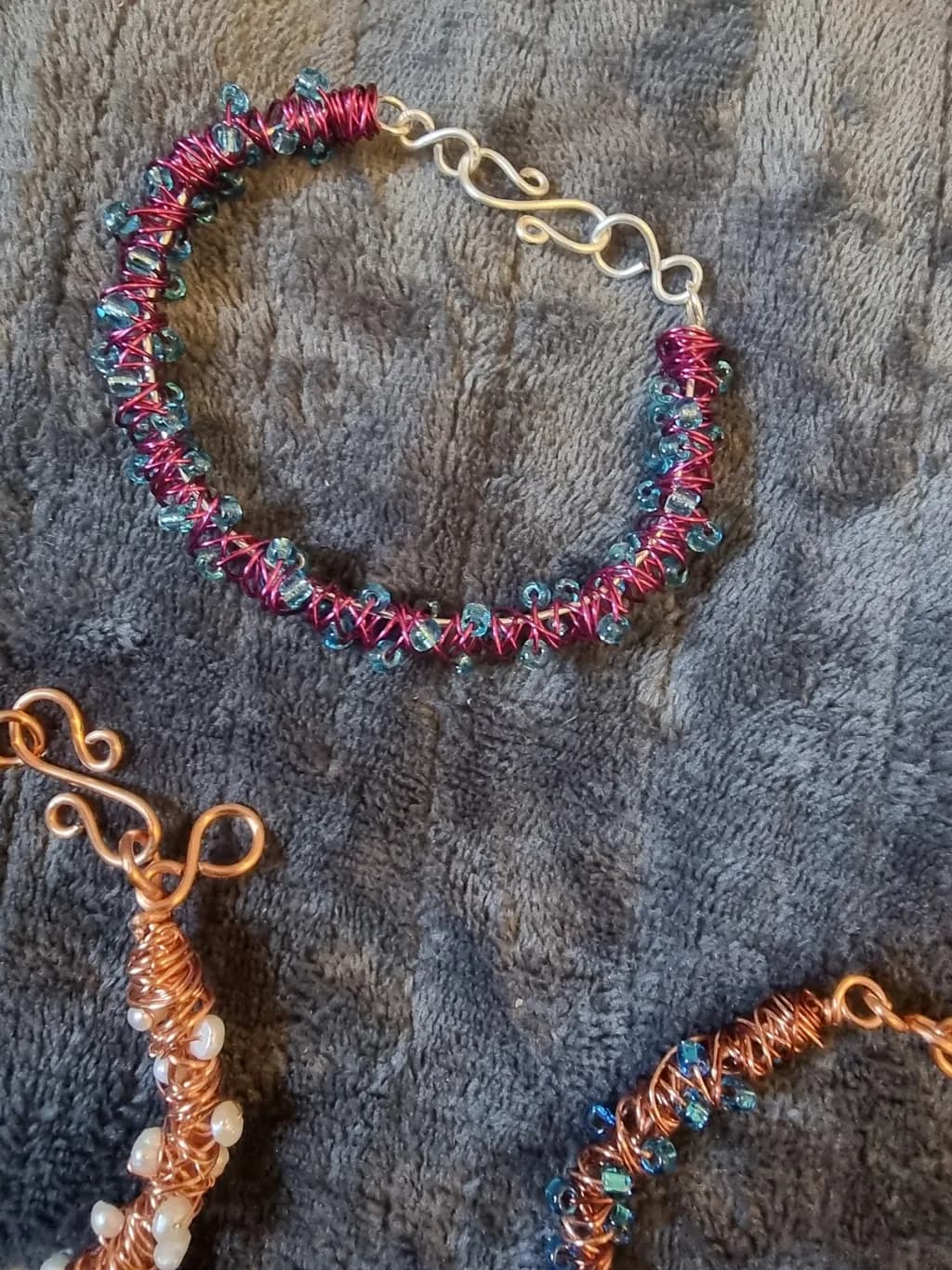Whimsical Waves: A Handcrafted Bracelet of Vibrant Beads and Twisted Wire Elegance