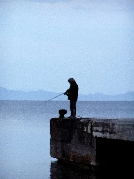 Whispers of the Deep: A Solitary Fisherman at Dusk