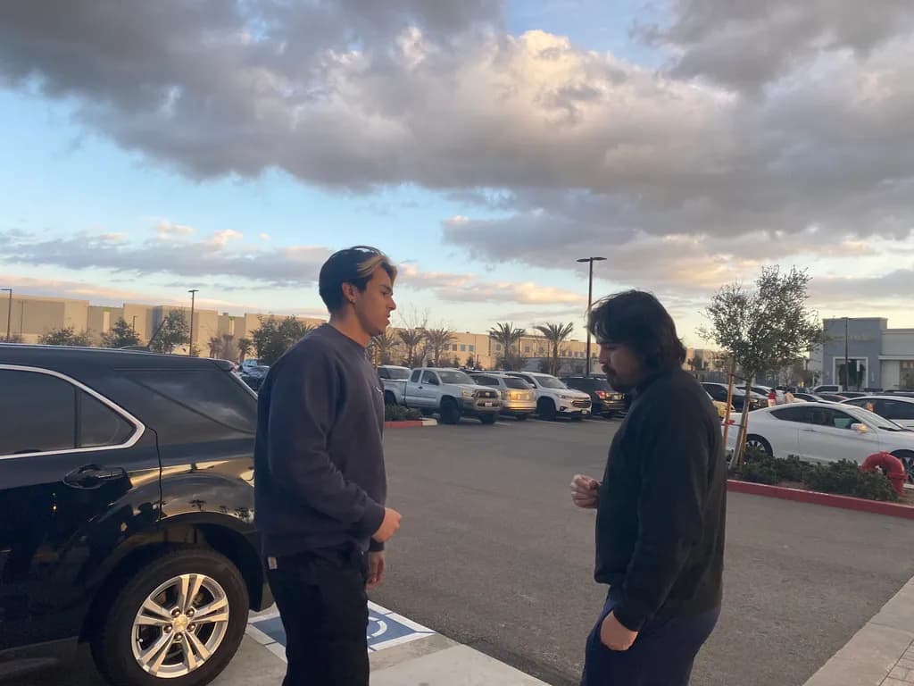 Urban Conversations: A Moment Between Friends Under a Cloudy Sky