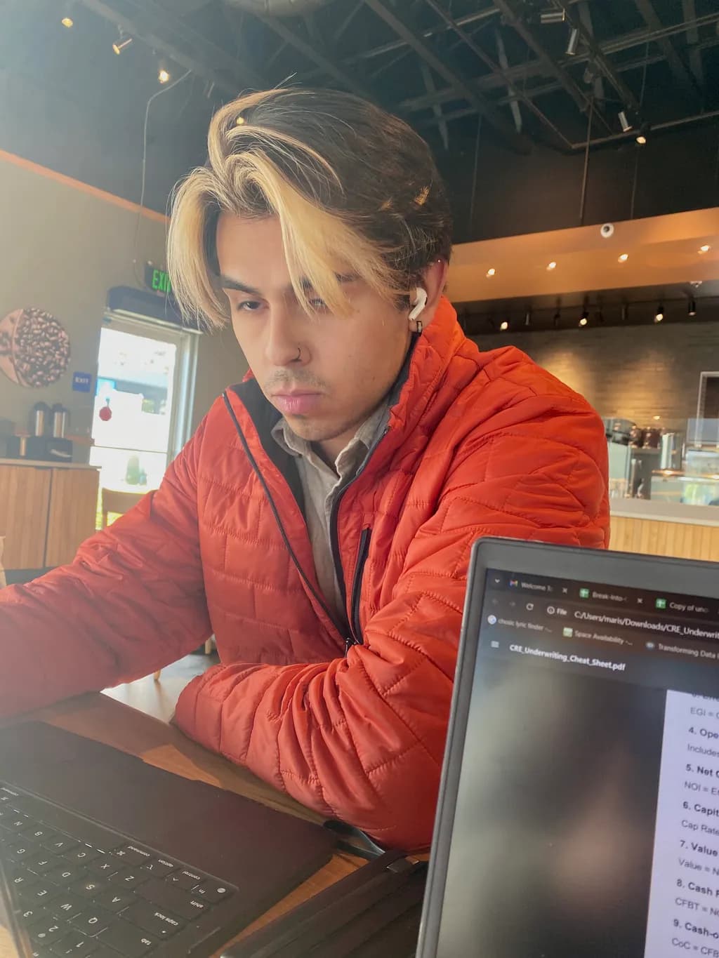Focused Reflections: A Moment of Contemplation in a Cozy Café Setting