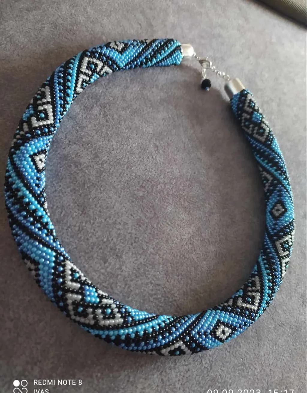 Elegant Blue and Black Beaded Necklace with Geometric Patterns