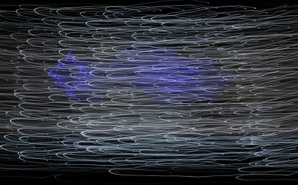 Whispers of Light: A Dance of Motion and Color in Abstract Form