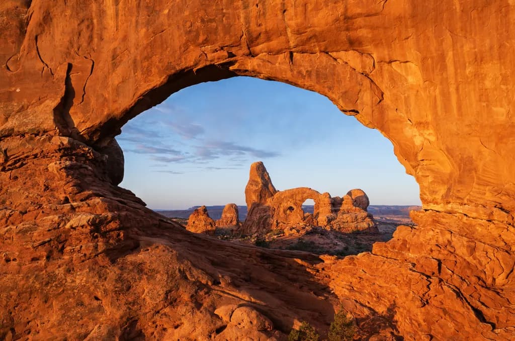 Desert Archway: A Majestic View of Nature's Rocky Skyline at Dawn
