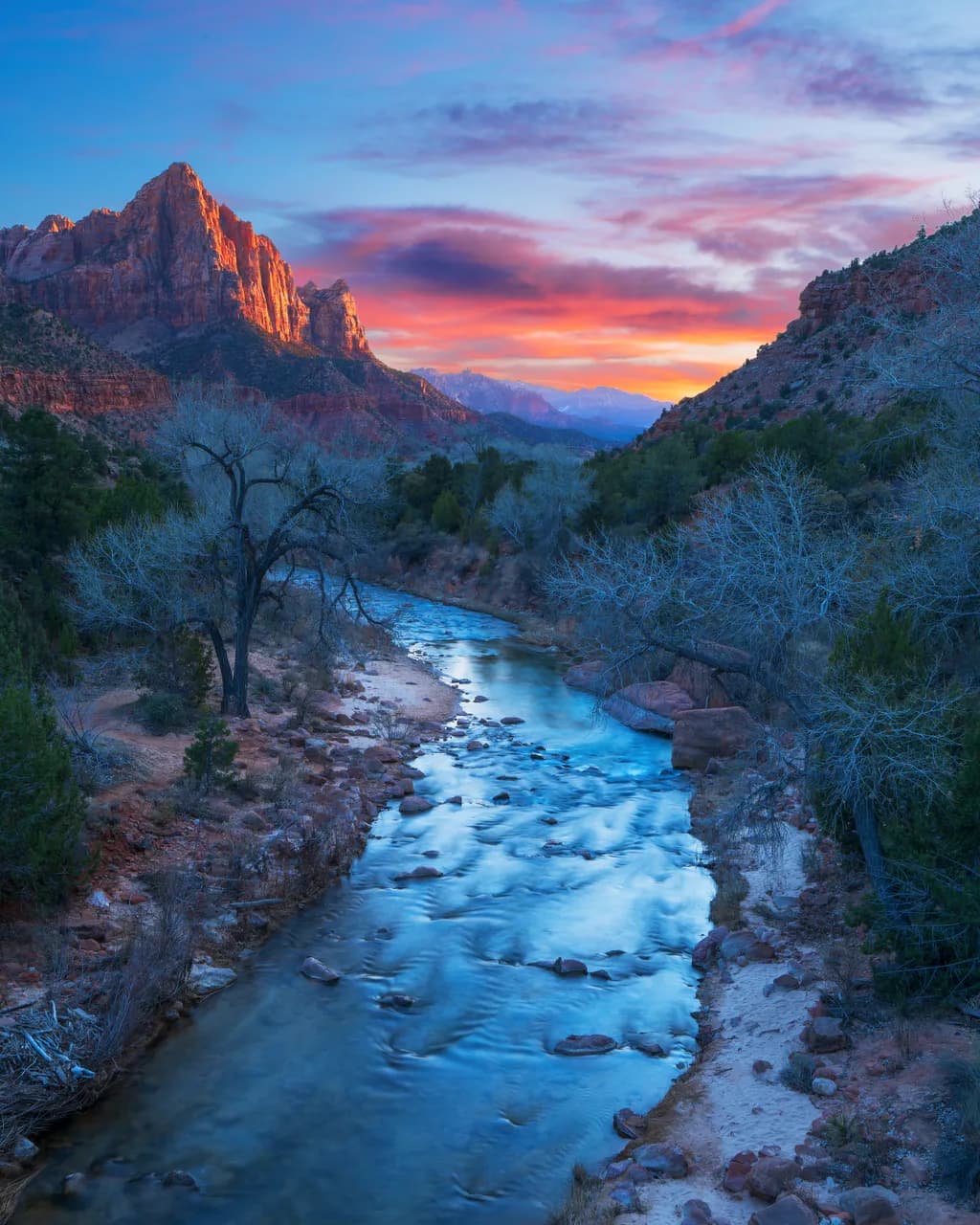 Serenity at Dusk: A Tranquil River Flowing Through Majestic Mountains in Zion National Park