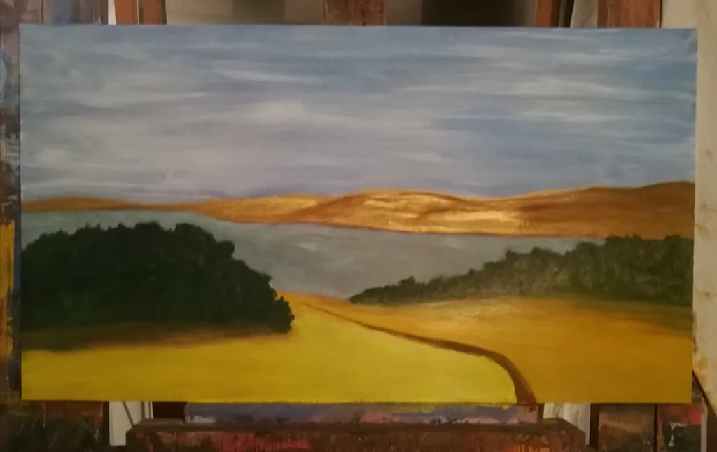 Golden Horizons: A Serene Landscape of Fields and Water
