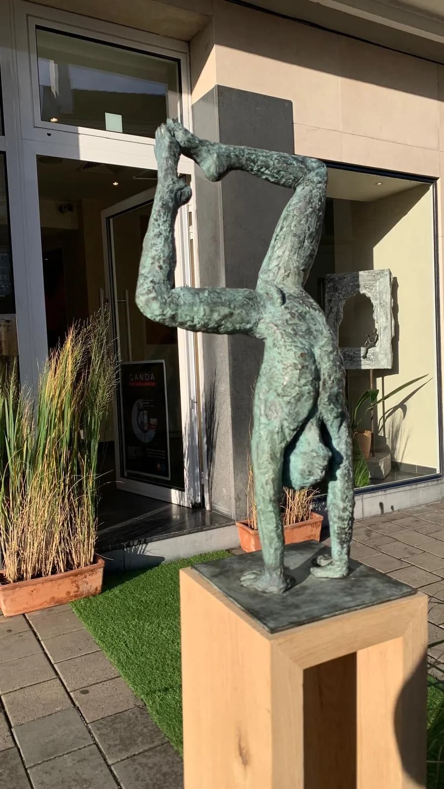 Balancing on the Edge: A Dance of Strength and Grace in Bronze