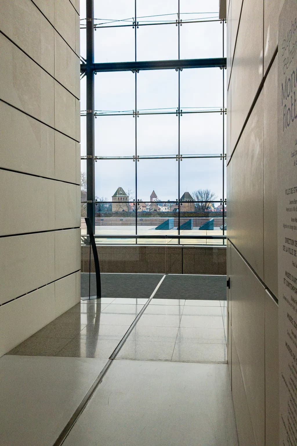 Framing Serenity: A Glimpse Through Glass and Stone in Modern Architecture