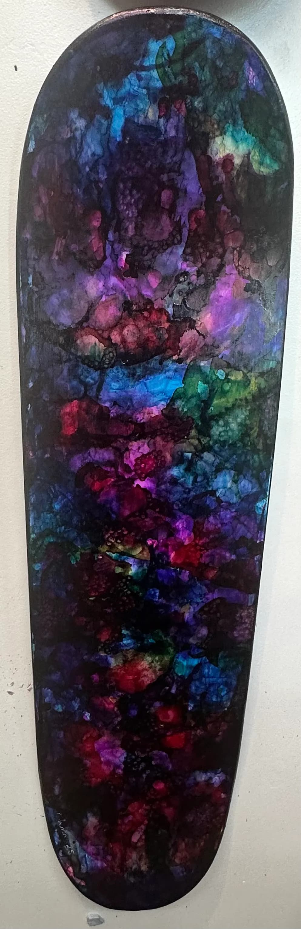 Cosmic Dreams: A Vibrant Journey Through Color and Texture on Skateboard Art