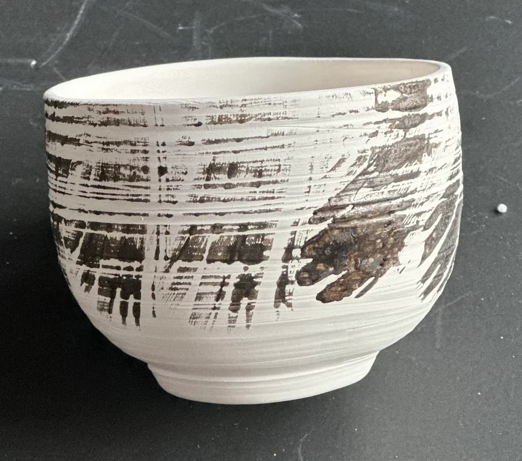 Textured Harmony: A Handcrafted Ceramic Bowl with Earthy Accents