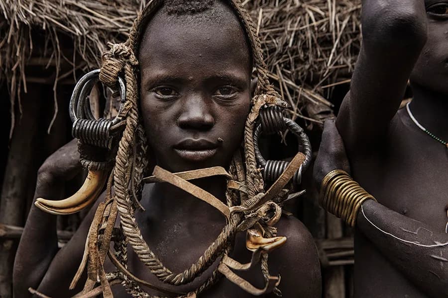 Cultural Echoes: A Portrait of Resilience and Identity in Traditional Adornment