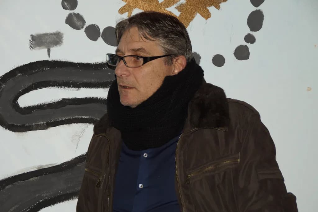 Casual Elegance: A Portrait of Contemplation in Glasses and Scarf