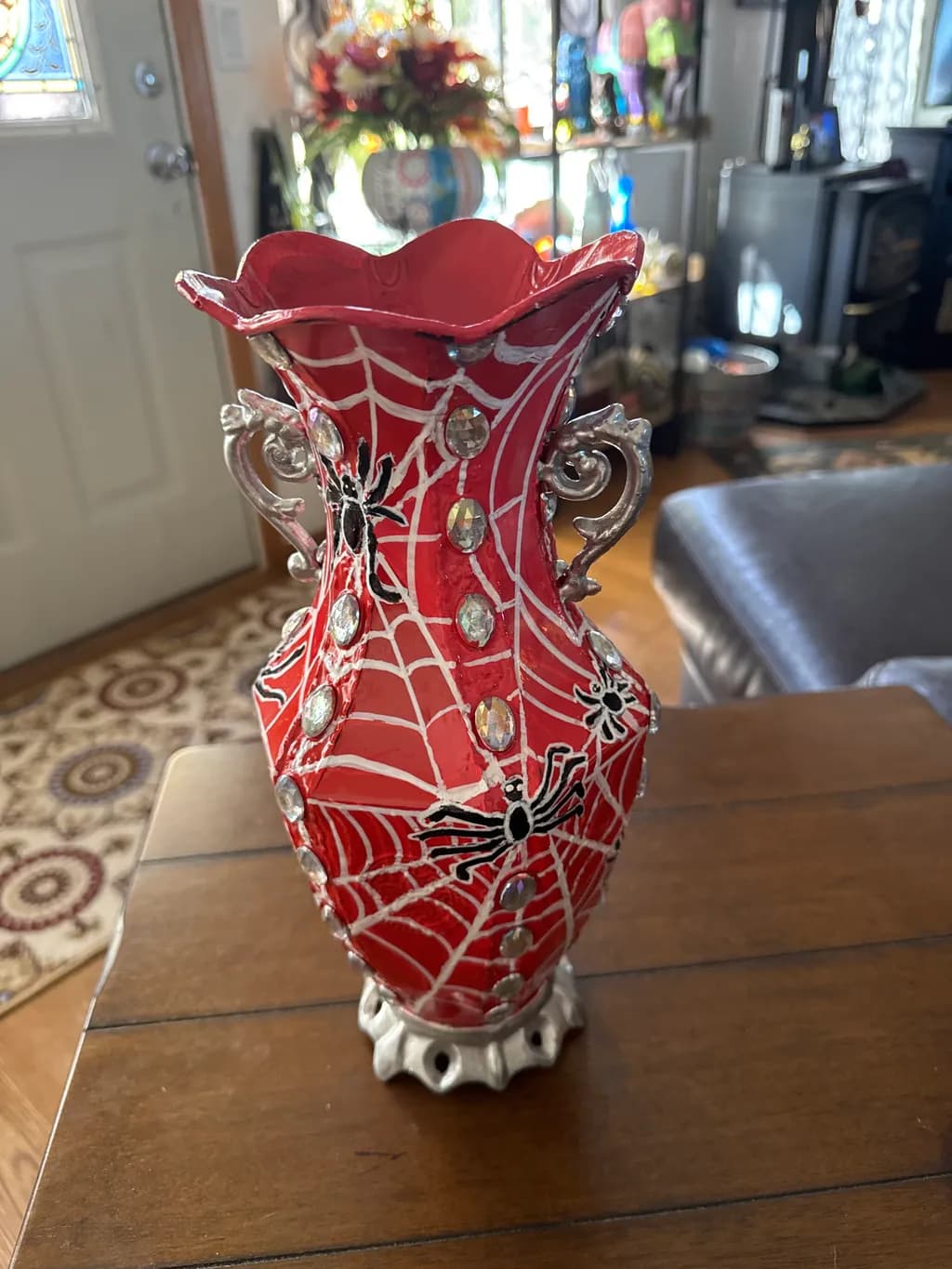 Whimsical Webs: A Spooktacular Red Vase with Sparkling Charm