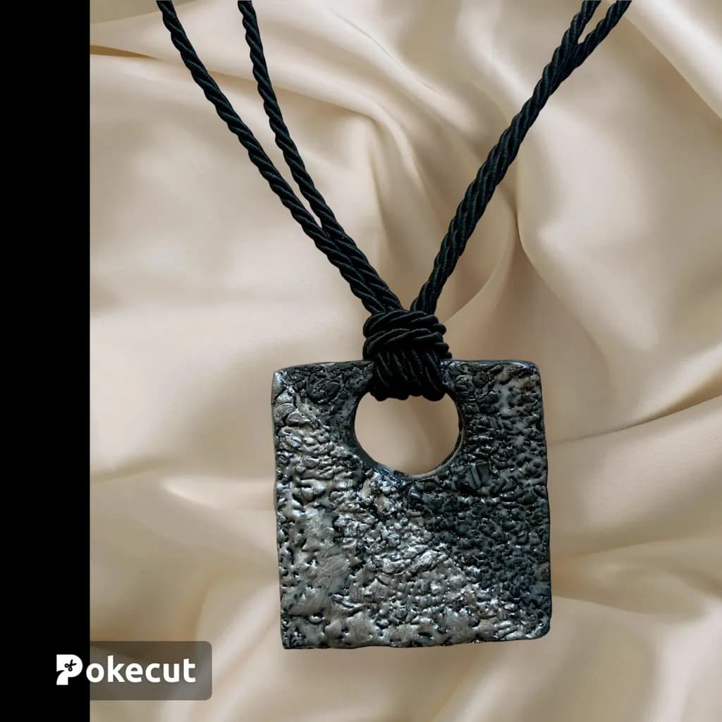 Textured Elegance: A Unique Black Pendant Necklace for Effortless Style