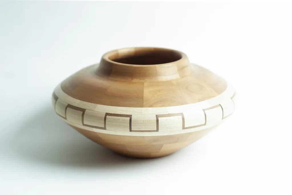 Elegant Handcrafted Wooden Bowl with Intricate Inlay Design