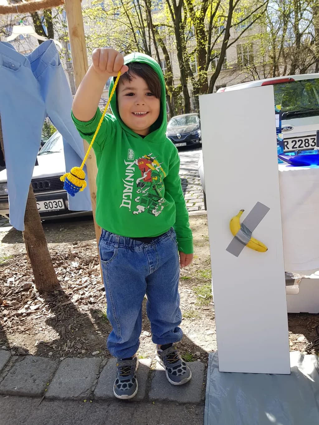 Joyful Moments: A Young Artist's Playful Encounter with Creativity and Nature