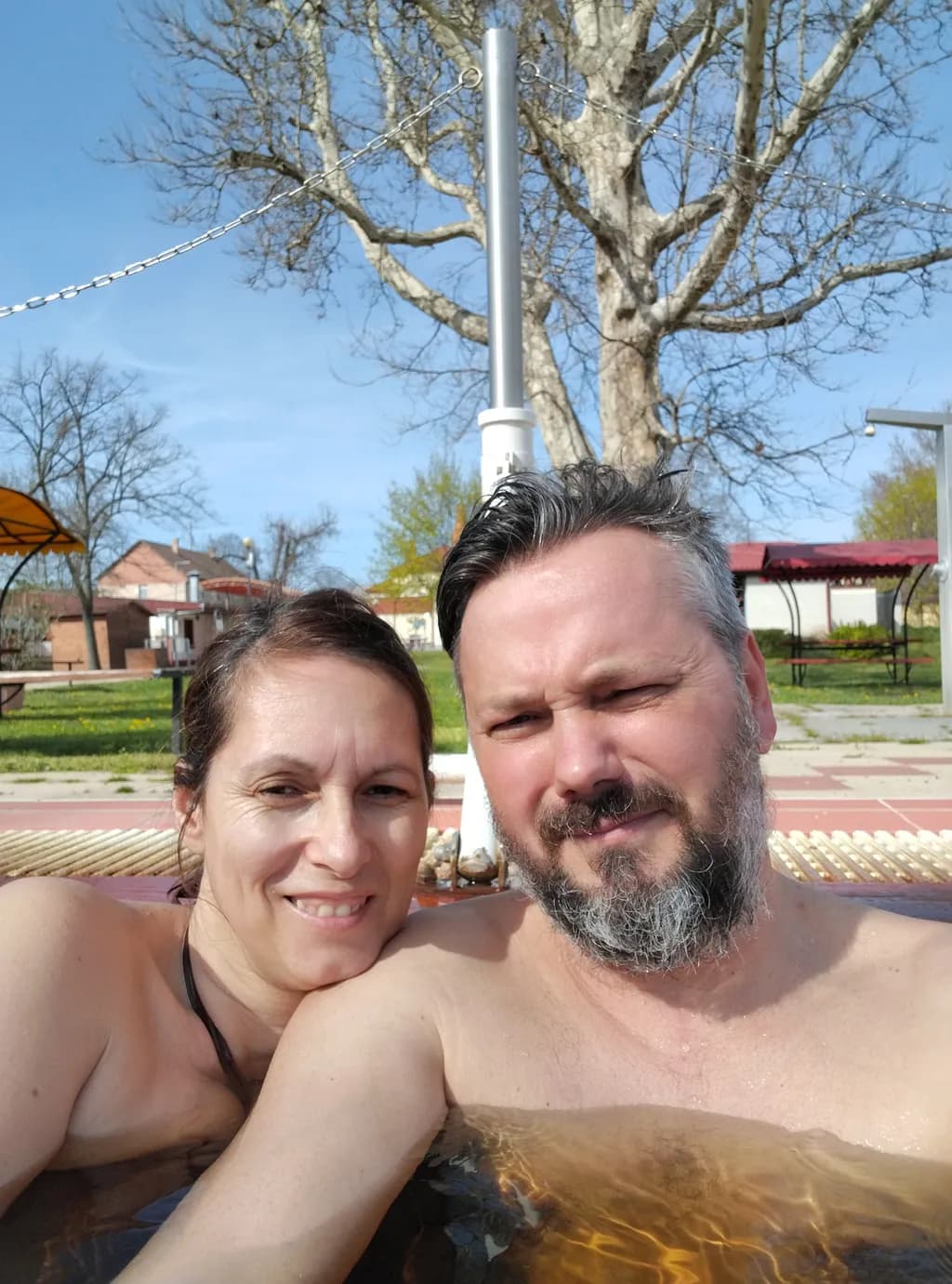 Sunlit Serenity: A Couple's Joyful Escape in Nature's Embrace