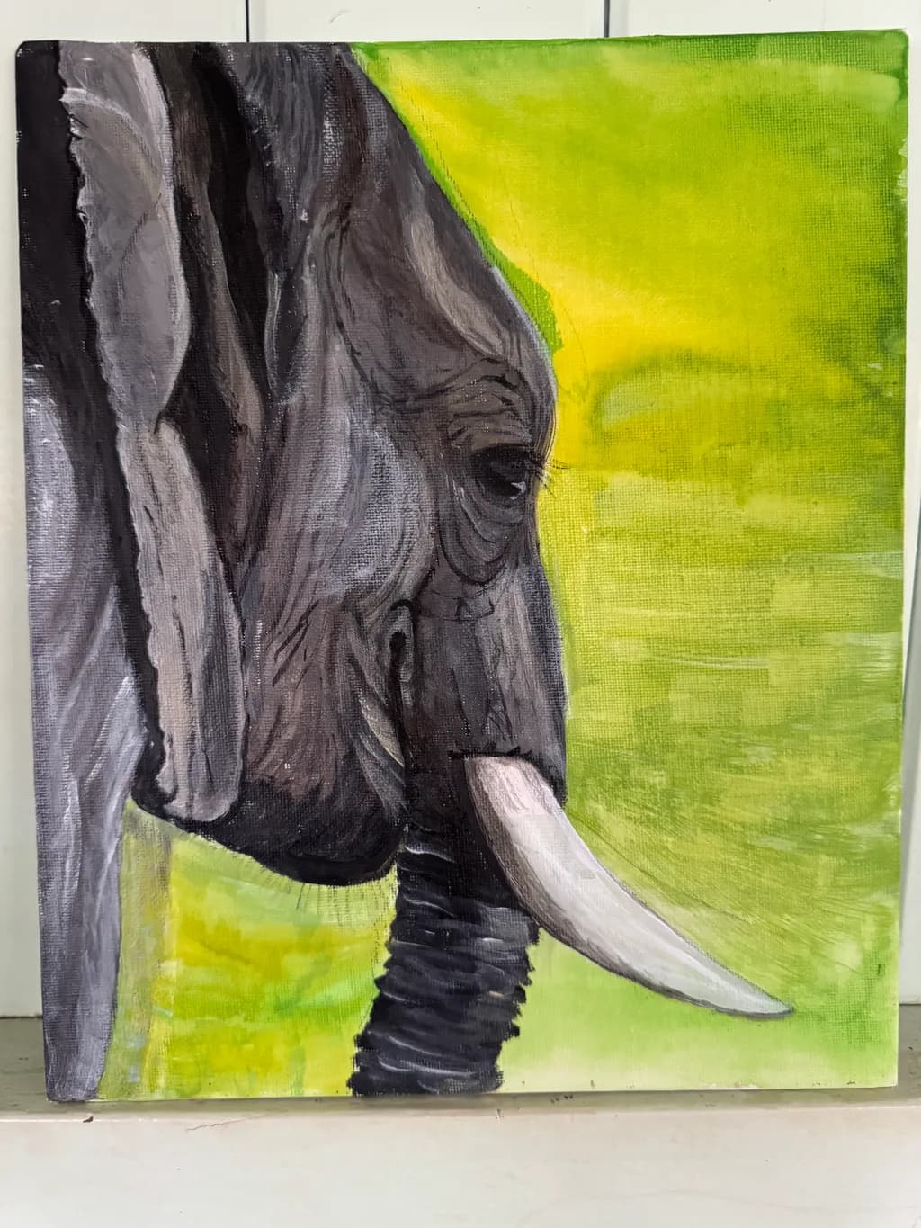 Majestic Presence: A Portrait of an Elephant in Vibrant Green Canvas