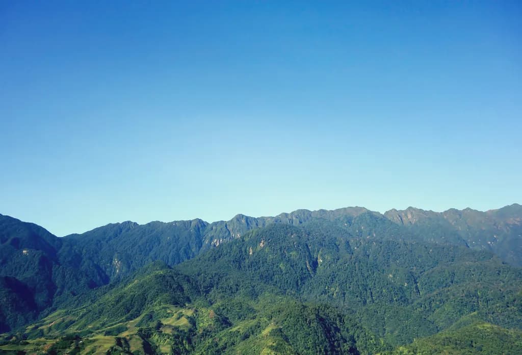 Whispers of the Mountains: A Serene Landscape Under a Clear Blue Sky