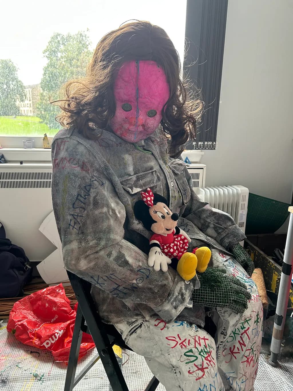 Masked Figure with Minnie