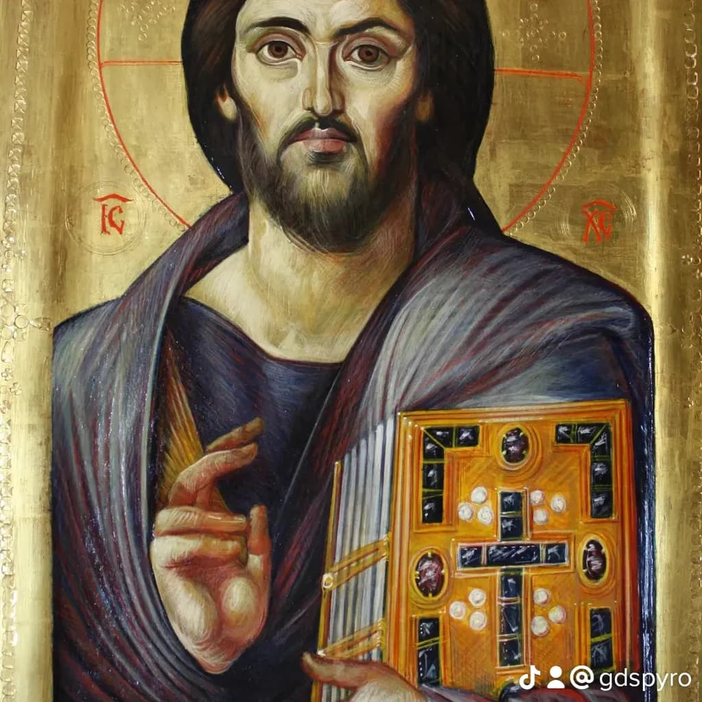 Divine Presence: A Golden Icon of Christ Holding the Gospel