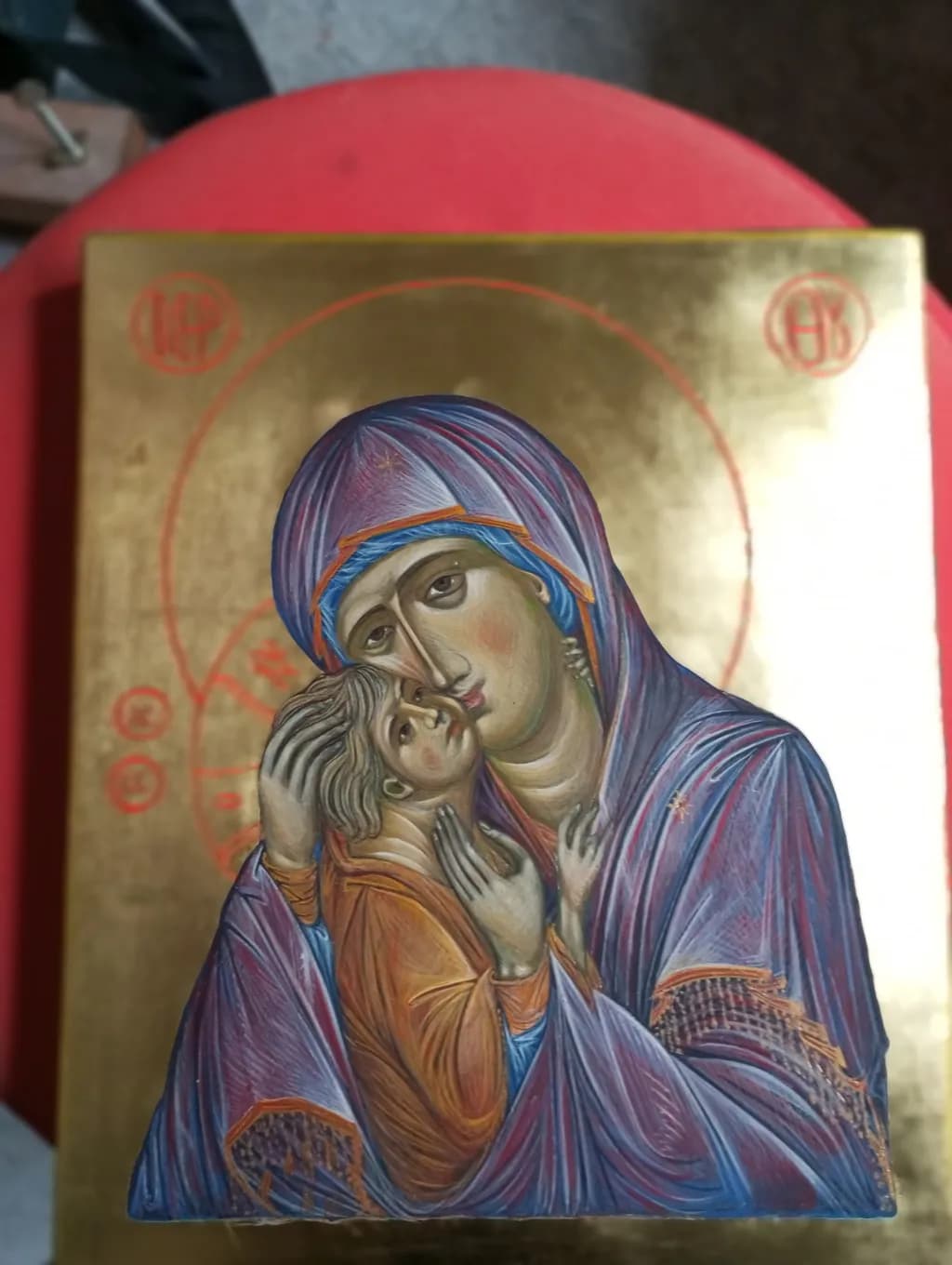Tender Embrace: A Sacred Icon of Mother and Child in Vibrant Colors and Gold Leaf Elegance