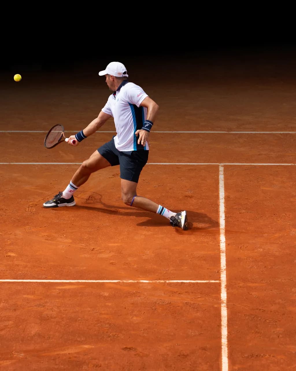 Dynamic Tennis Action on Clay: A Moment of Precision and Power