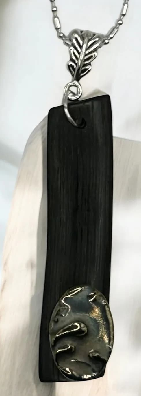 Elegant Fusion: Handcrafted Black Wood Pendant with Silver Accent