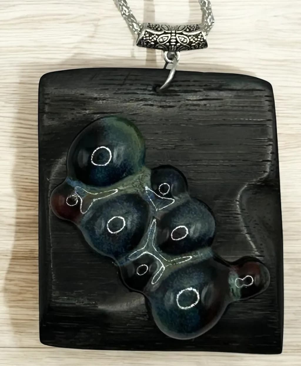 Whimsical Harmony: A Unique Handcrafted Pendant of Organic Elegance in Dark Wood and Colorful Resin