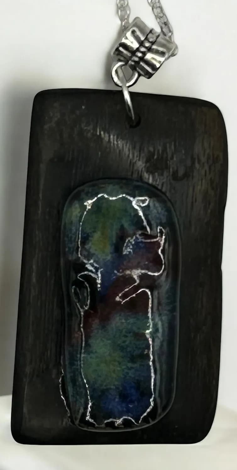Whispers of Nature: A Handcrafted Pendant of Color and Wood Elegance