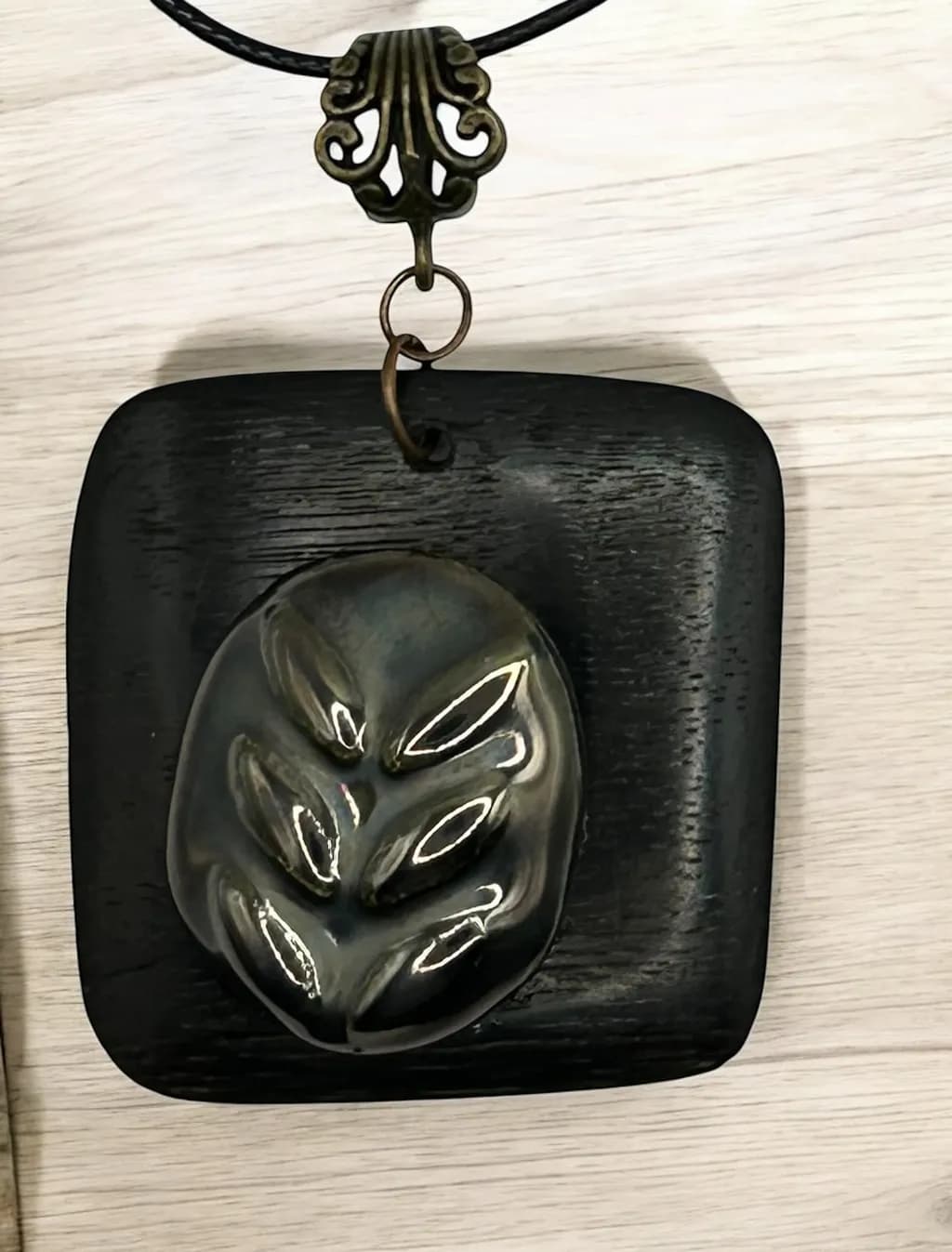 Elegant Leaf Imprint Pendant on Black Wood Base - A Unique Artisan Necklace for Nature Lovers