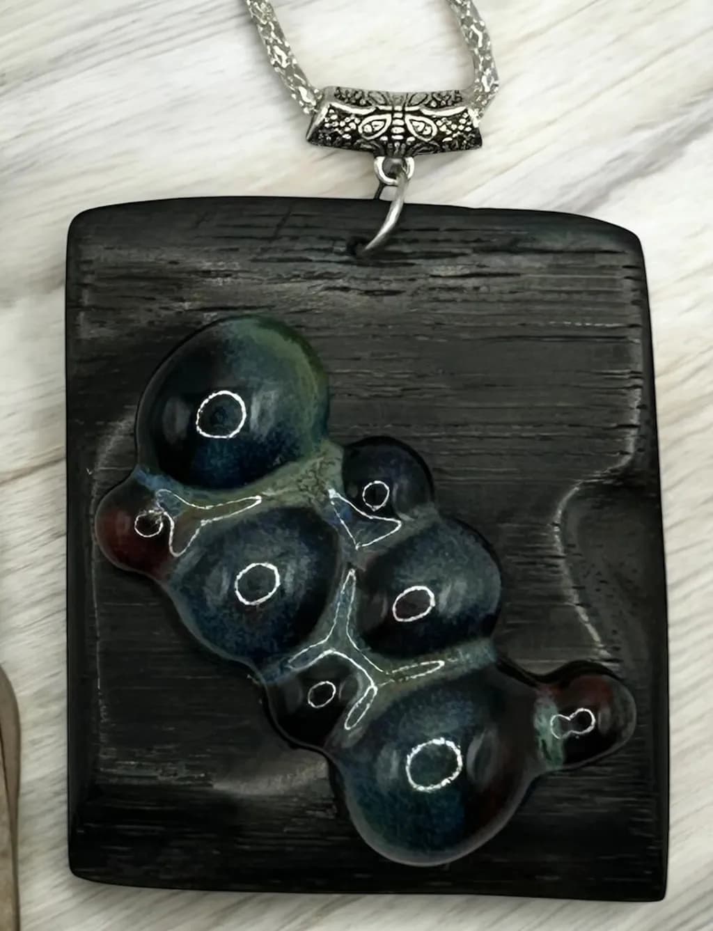 Ethereal Harmony: A Handcrafted Pendant of Organic Elegance in Deep Blues and Rich Blacks